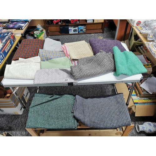 283 - Box containing a quantity of craft samples and throws inc a tartan wool blanket, cotton fabrics, vin... 