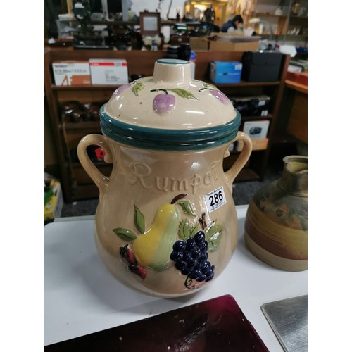 286 - A box containing a quantity of crockery and placemats inc a large lidded Rumpot, earthenware jug wit... 
