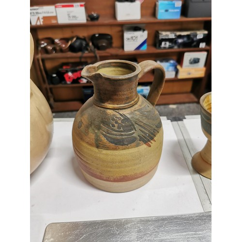 286 - A box containing a quantity of crockery and placemats inc a large lidded Rumpot, earthenware jug wit... 