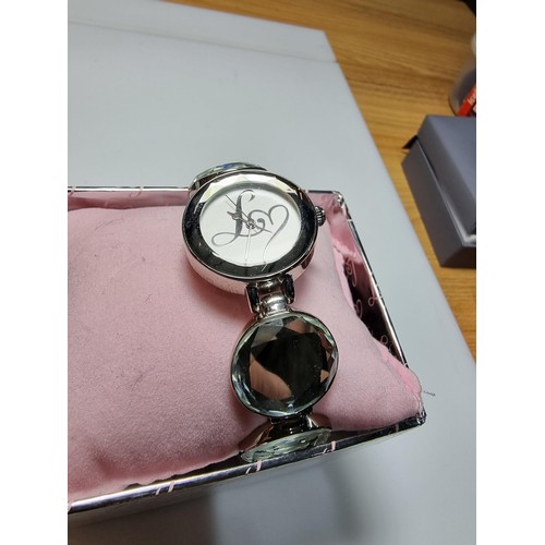 319 - A boxed unused Lipsy London ladies watch with a mirrored style strap.