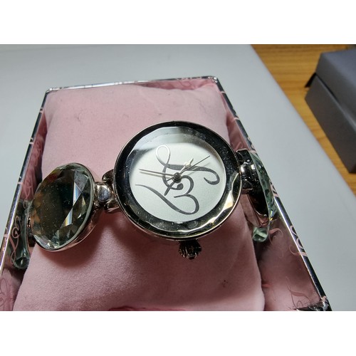 319 - A boxed unused Lipsy London ladies watch with a mirrored style strap.