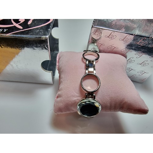 319 - A boxed unused Lipsy London ladies watch with a mirrored style strap.