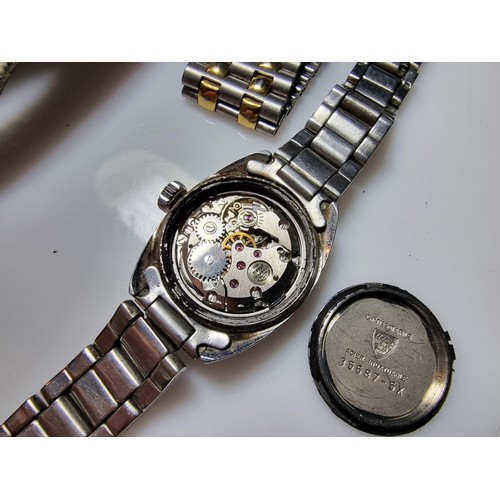 321 - A quantity of watches along with a quantity of costume earrings to include a a genuine Tissot sea st... 