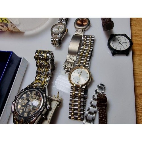 321 - A quantity of watches along with a quantity of costume earrings to include a a genuine Tissot sea st... 