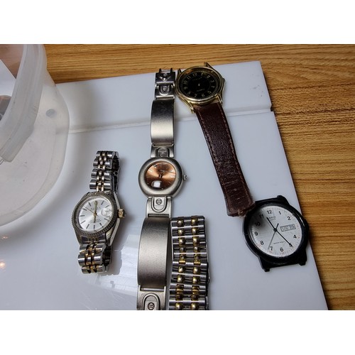 321 - A quantity of watches along with a quantity of costume earrings to include a a genuine Tissot sea st... 