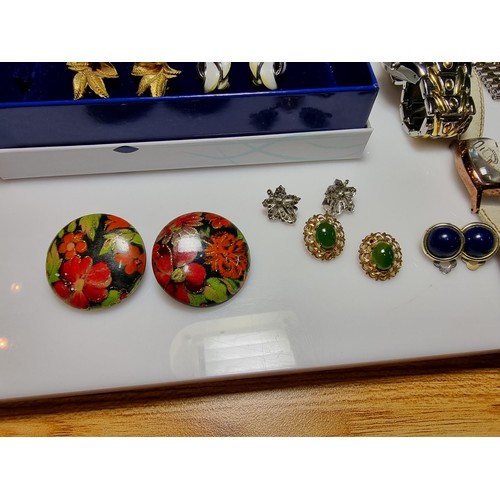 321 - A quantity of watches along with a quantity of costume earrings to include a a genuine Tissot sea st... 