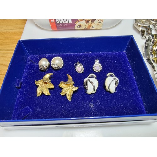 321 - A quantity of watches along with a quantity of costume earrings to include a a genuine Tissot sea st... 