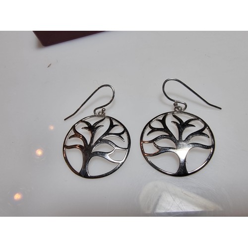 330 - A pair of unused 925 silver earrings with a tree design along with an unused gold plated deer pendan... 