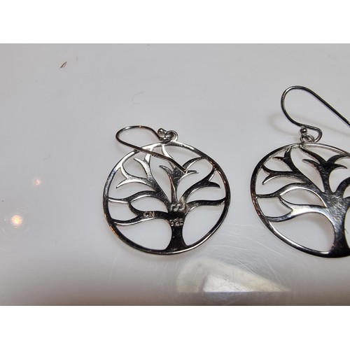 330 - A pair of unused 925 silver earrings with a tree design along with an unused gold plated deer pendan... 