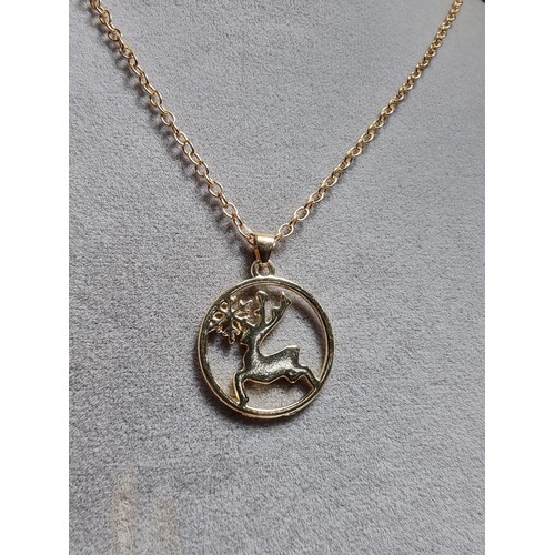 330 - A pair of unused 925 silver earrings with a tree design along with an unused gold plated deer pendan... 