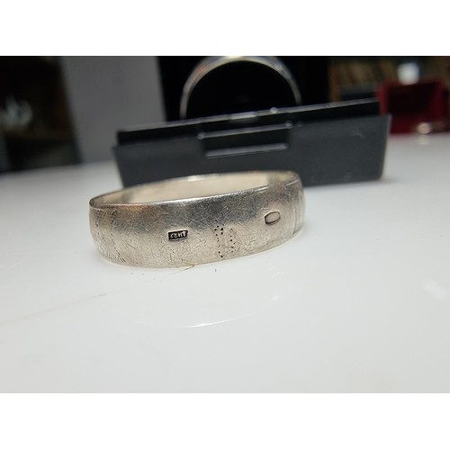333 - An as new Tungsten carbide ring with colourful abalone shell all the way around along with a sterlin... 