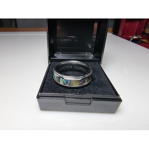 333 - An as new Tungsten carbide ring with colourful abalone shell all the way around along with a sterlin... 