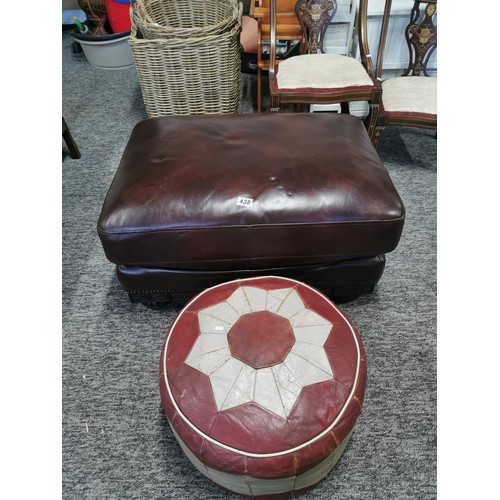 438 - Vintage circular red and grey leather pouffe in good order along with a large leather wooden based f... 