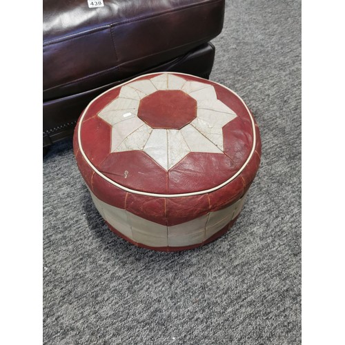 438 - Vintage circular red and grey leather pouffe in good order along with a large leather wooden based f... 