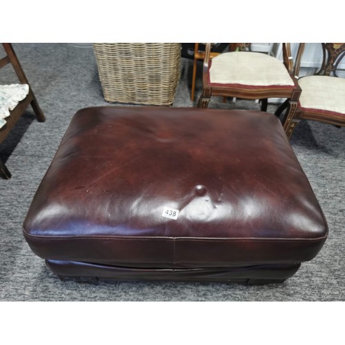 438 - Vintage circular red and grey leather pouffe in good order along with a large leather wooden based f... 