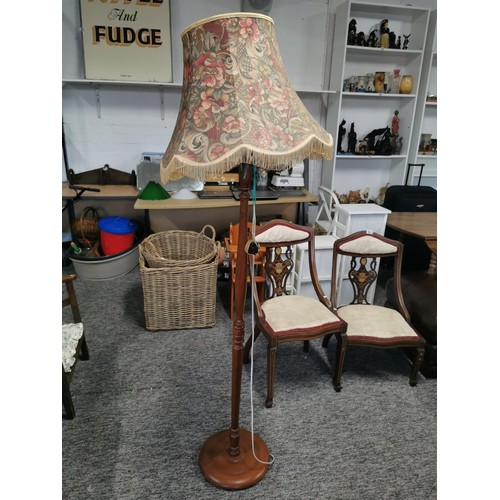 439 - Tall wooden standard lamp complete with multi coloured flora shade with tassels in good order, lamp ... 