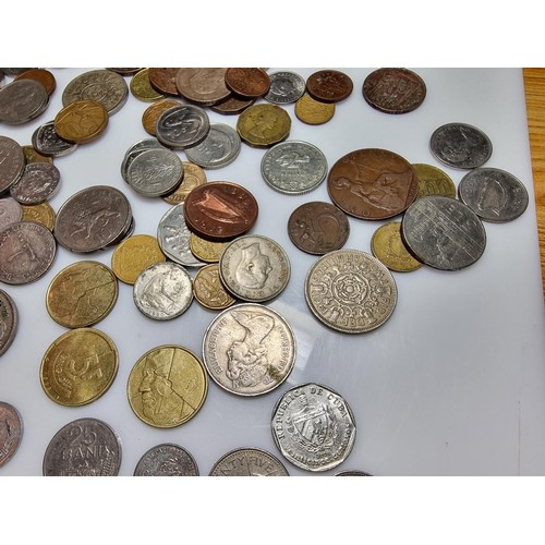 340 - A large quantity of various coins, to include British and world coins.