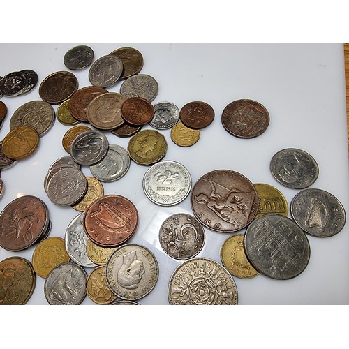 340 - A large quantity of various coins, to include British and world coins.