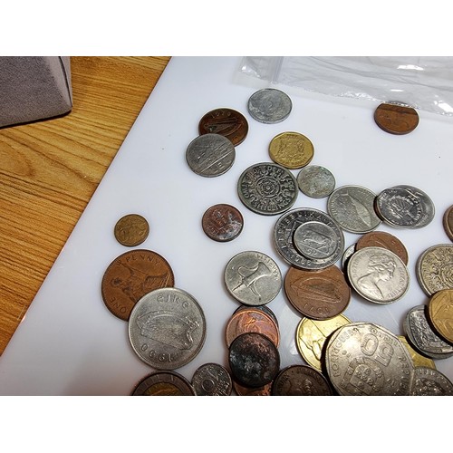 340 - A large quantity of various coins, to include British and world coins.