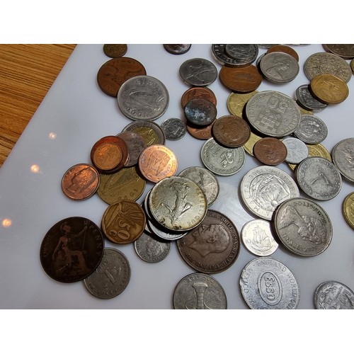 340 - A large quantity of various coins, to include British and world coins.