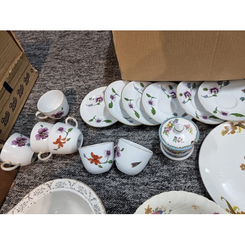 266 - A box containing a large quantity of tea sets to include some good brand names, Wedgwood, Royal Worc... 