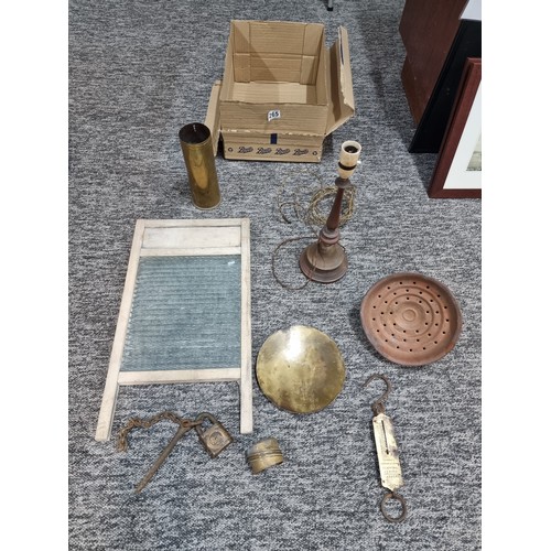 265 - A box of collectables to include a good vintage washboard, heavy copper lamp, brassware, etc.
