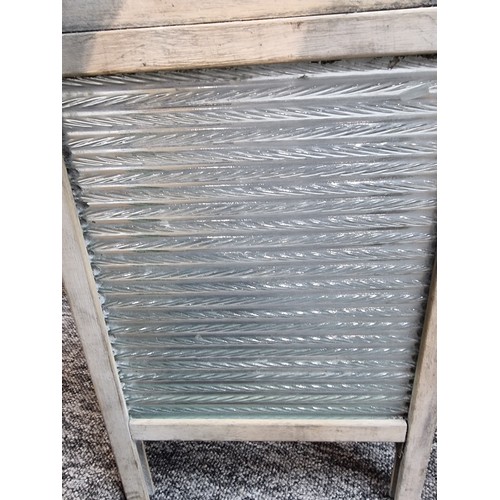 265 - A box of collectables to include a good vintage washboard, heavy copper lamp, brassware, etc.