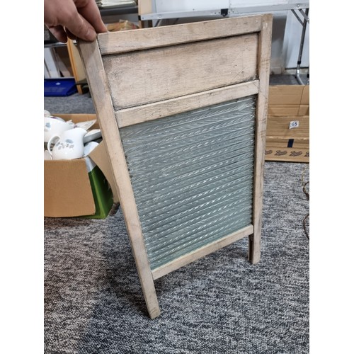 265 - A box of collectables to include a good vintage washboard, heavy copper lamp, brassware, etc.