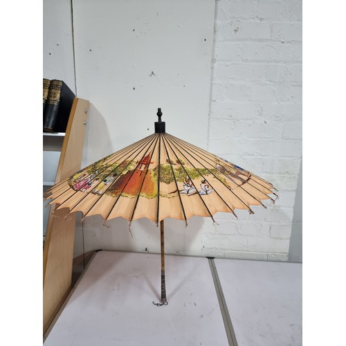 240A - Good antique Indian hand painted parasol with an ornate sterling silver handle and a burn design to ... 