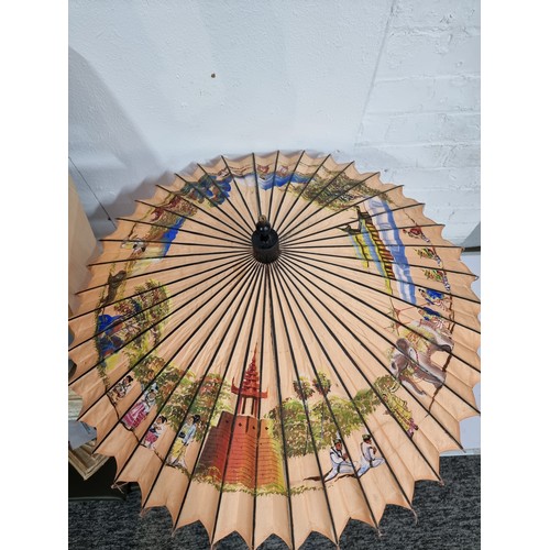 240A - Good antique Indian hand painted parasol with an ornate sterling silver handle and a burn design to ... 