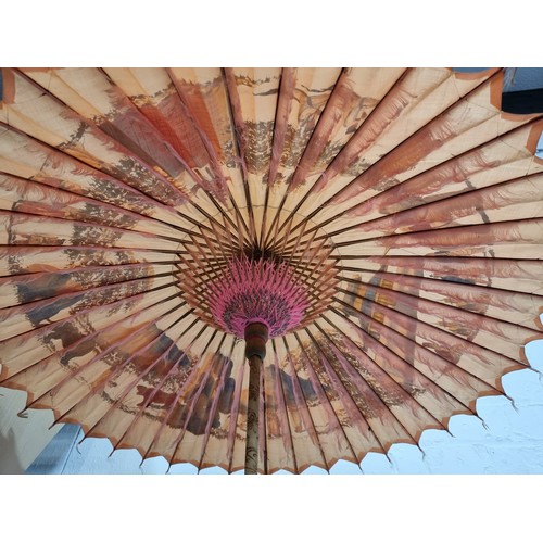 240A - Good antique Indian hand painted parasol with an ornate sterling silver handle and a burn design to ... 