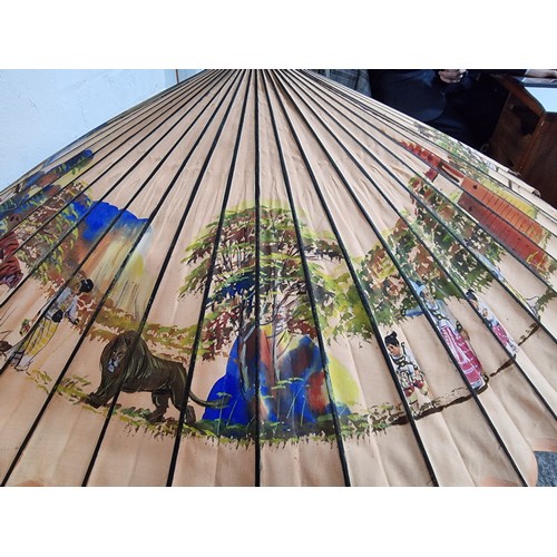 240A - Good antique Indian hand painted parasol with an ornate sterling silver handle and a burn design to ... 