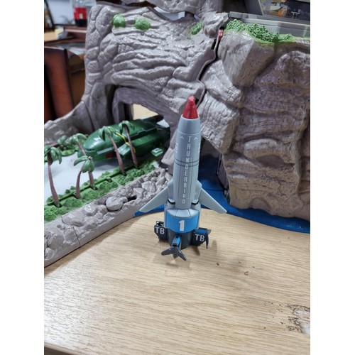 233 - A vintage Thunderbirds Tracy island playset to include 2 Thunderbird vehicles numbers 1 and number 2... 