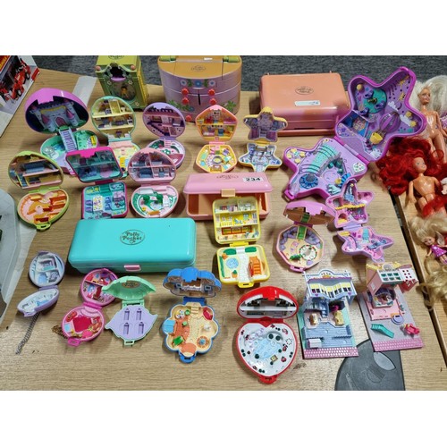 234 - A large quantity of vintage Polly Pocket toys to include many different sets with many figures, alon... 