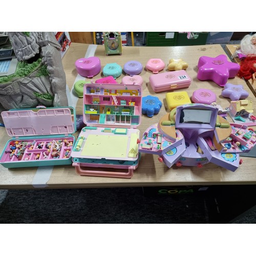 234 - A large quantity of vintage Polly Pocket toys to include many different sets with many figures, alon... 