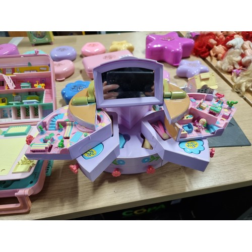 234 - A large quantity of vintage Polly Pocket toys to include many different sets with many figures, alon... 