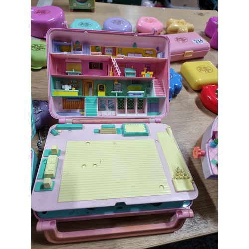 234 - A large quantity of vintage Polly Pocket toys to include many different sets with many figures, alon... 