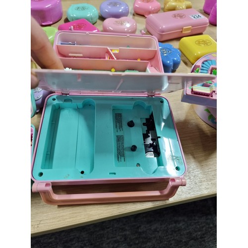 234 - A large quantity of vintage Polly Pocket toys to include many different sets with many figures, alon... 