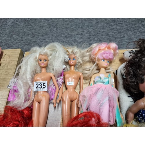 235 - A large quantity of various doll figures to include many Barbie dolls, some are earlier examples fro... 