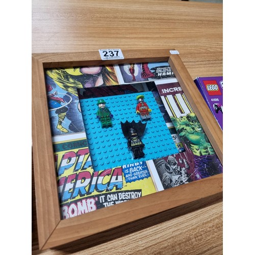 237 - 2x new and sealed Lego sets 41425, 41686 along with a pine framed Superhero Lego figure wall display... 