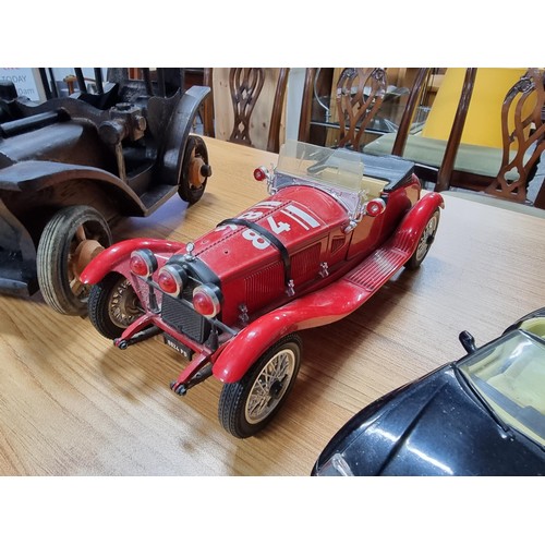 238 - A collection of model cars to include 4 large diecast model cars and 2 wooden model cars which inclu... 