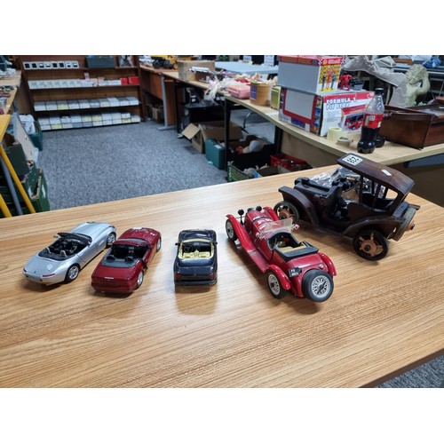 238 - A collection of model cars to include 4 large diecast model cars and 2 wooden model cars which inclu... 