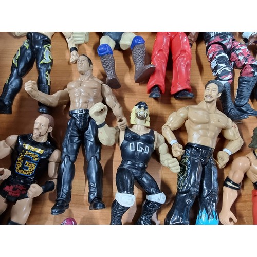 241 - A large collection of approx 26x action figures mostly of wrestlers from the early 2000's and on. To... 