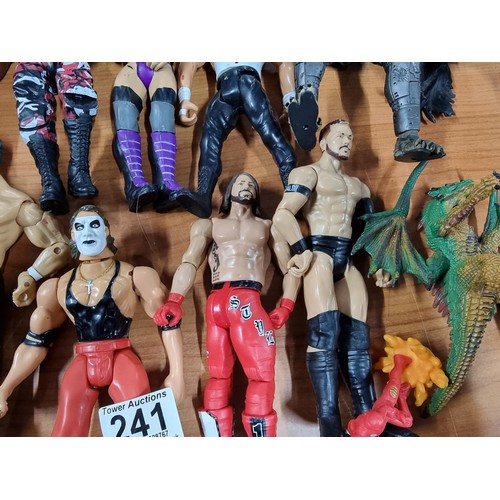 241 - A large collection of approx 26x action figures mostly of wrestlers from the early 2000's and on. To... 