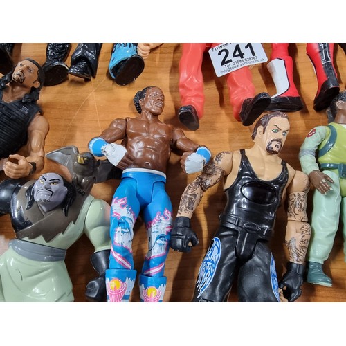 241 - A large collection of approx 26x action figures mostly of wrestlers from the early 2000's and on. To... 