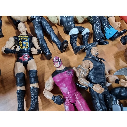 241 - A large collection of approx 26x action figures mostly of wrestlers from the early 2000's and on. To... 