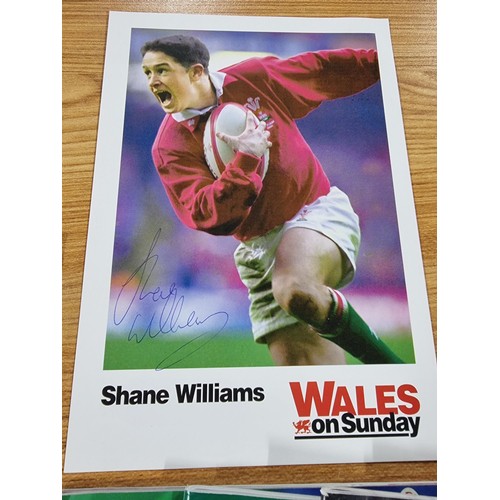 243 - A collectable rugby related lot to include a hand signed photo pf Shane Williams, a quantity of 10 r... 