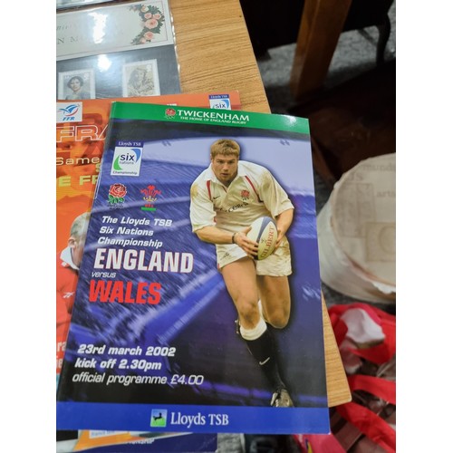 243 - A collectable rugby related lot to include a hand signed photo pf Shane Williams, a quantity of 10 r... 