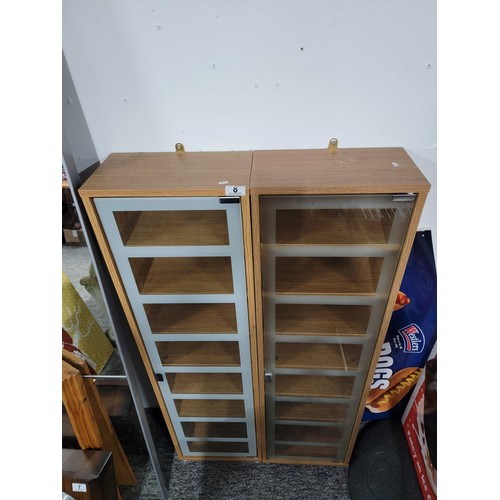 8 - Pair of glass front shelf units, each with 6 shelves some shelf pins are missing standing 123.5cm wi... 