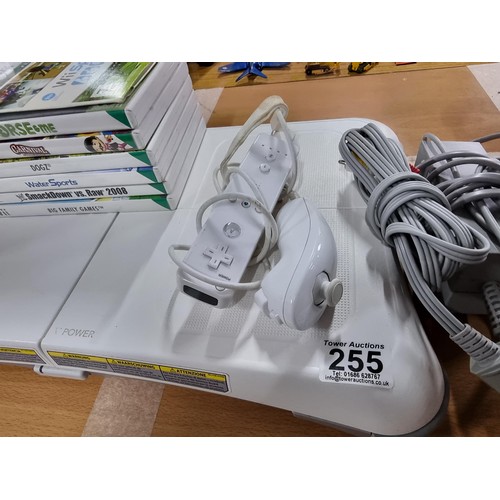 255 - A comprehensive Nintendo Wii games console set complete with Wii fit board and 7 games and controlle... 